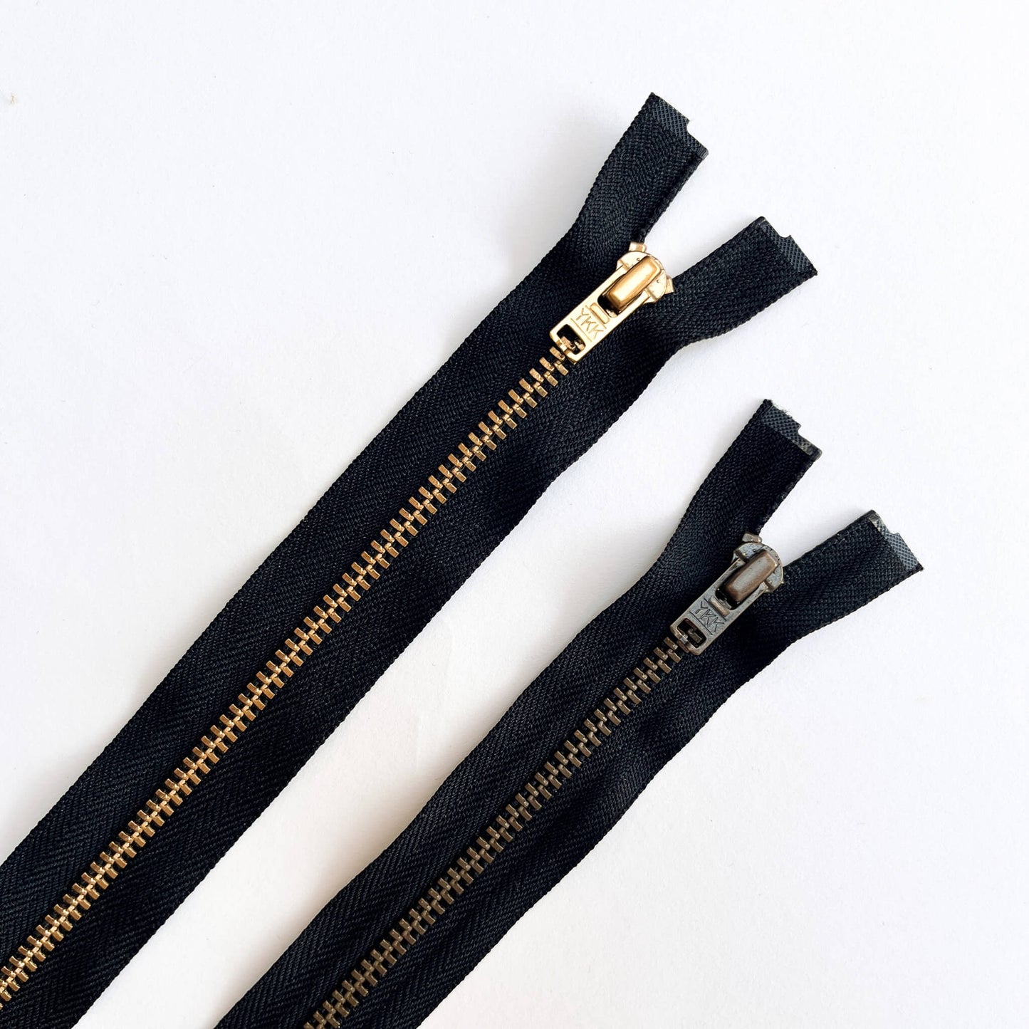 Black YKK #4.5 Open End brass teeth Zip, 100cm length YKK jeans zip with gold and brass metal teeth and auto-lock puller - Kleins Haberdashery