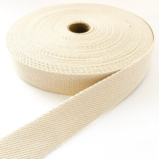 A roll of ecru cotton webbing strap