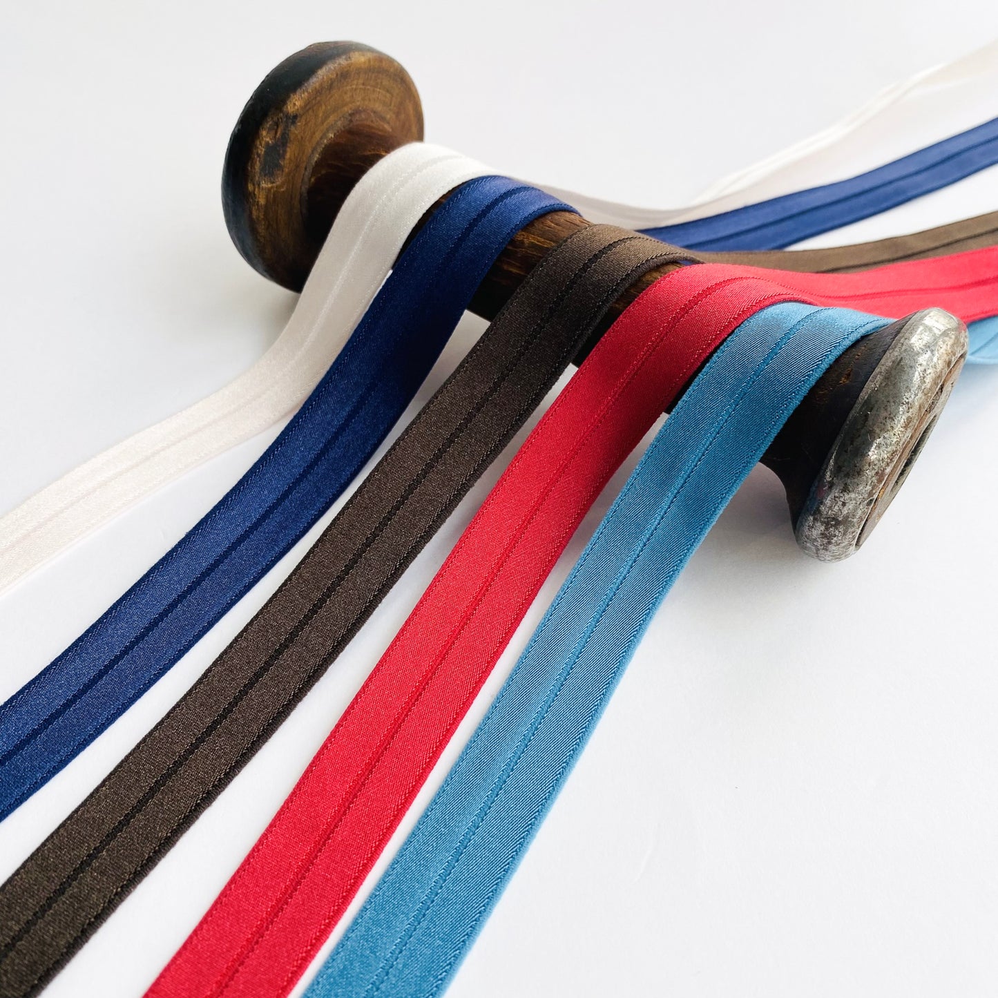 Soft stretch satin fold over elastic binding