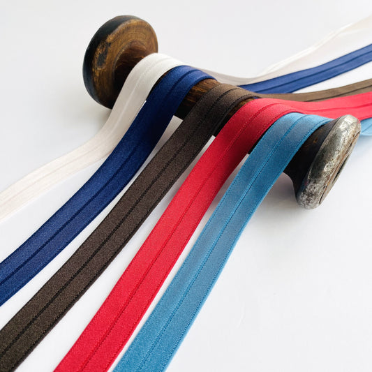 Soft stretch satin fold over elastic binding
