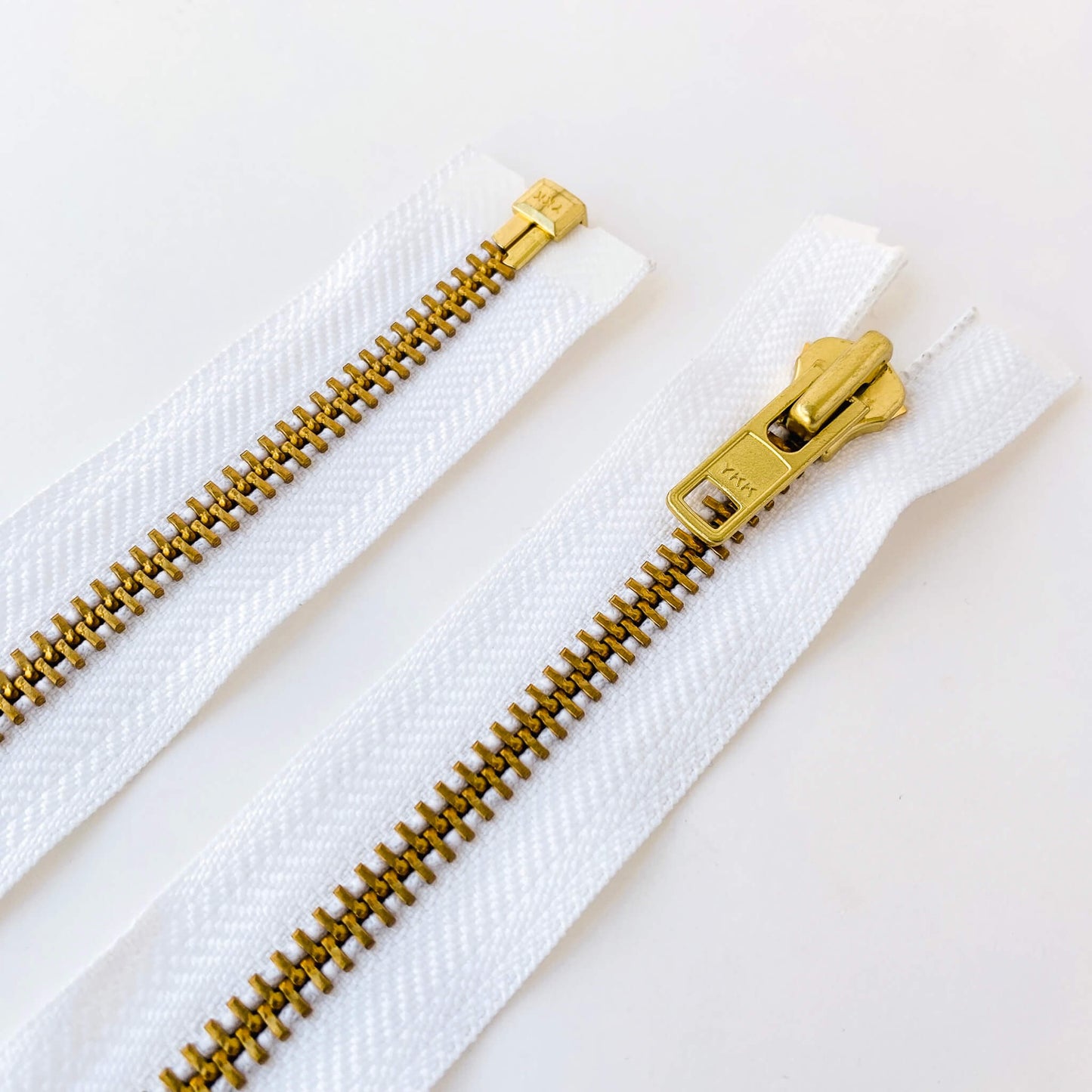 white metal open ended zipper