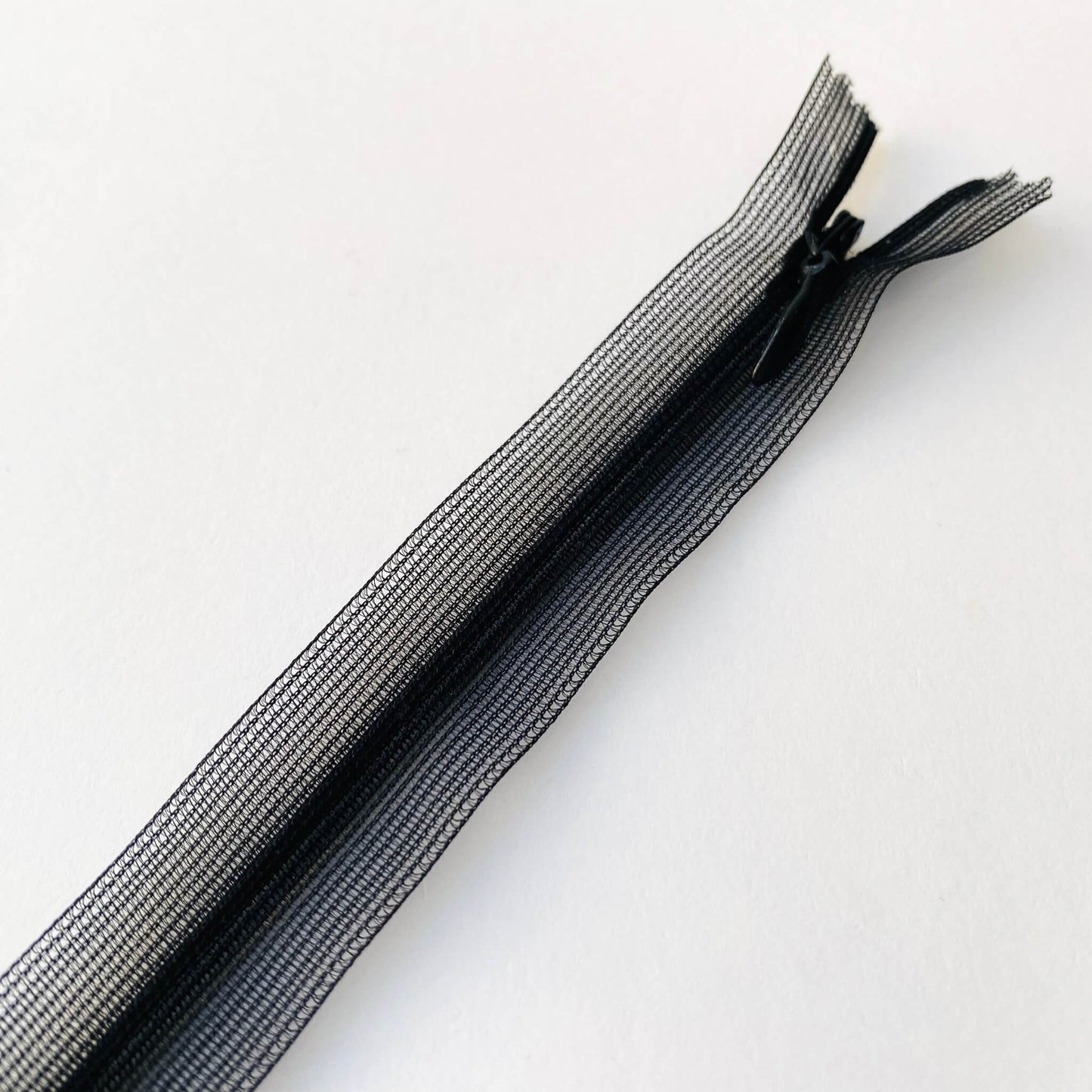 Featherweight invisible zip - 66cm length Couture featherweight invisible, concealed zip with closed-end for dressmaking.