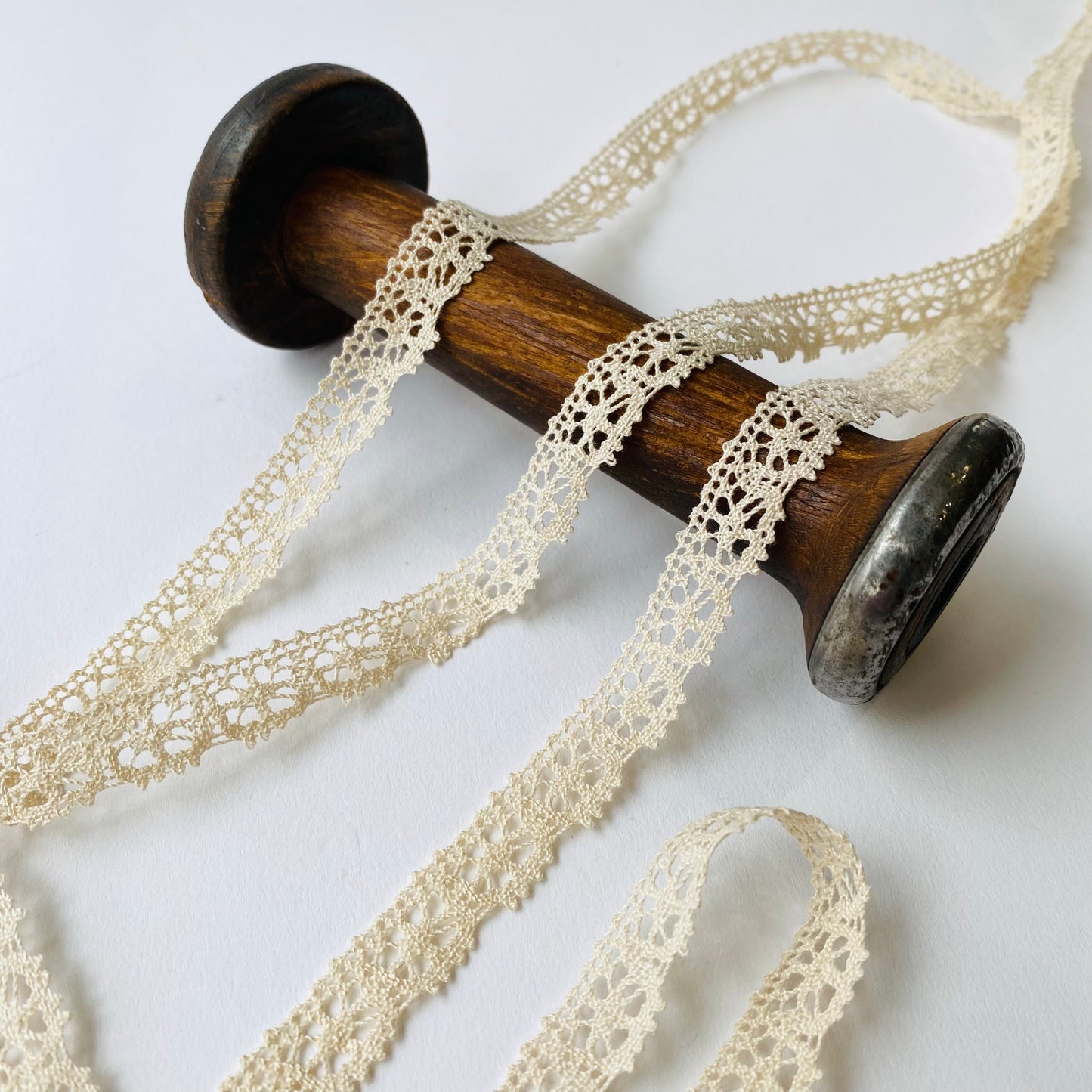 13mm wide French Cluny lace trim with a scalloped edge.
