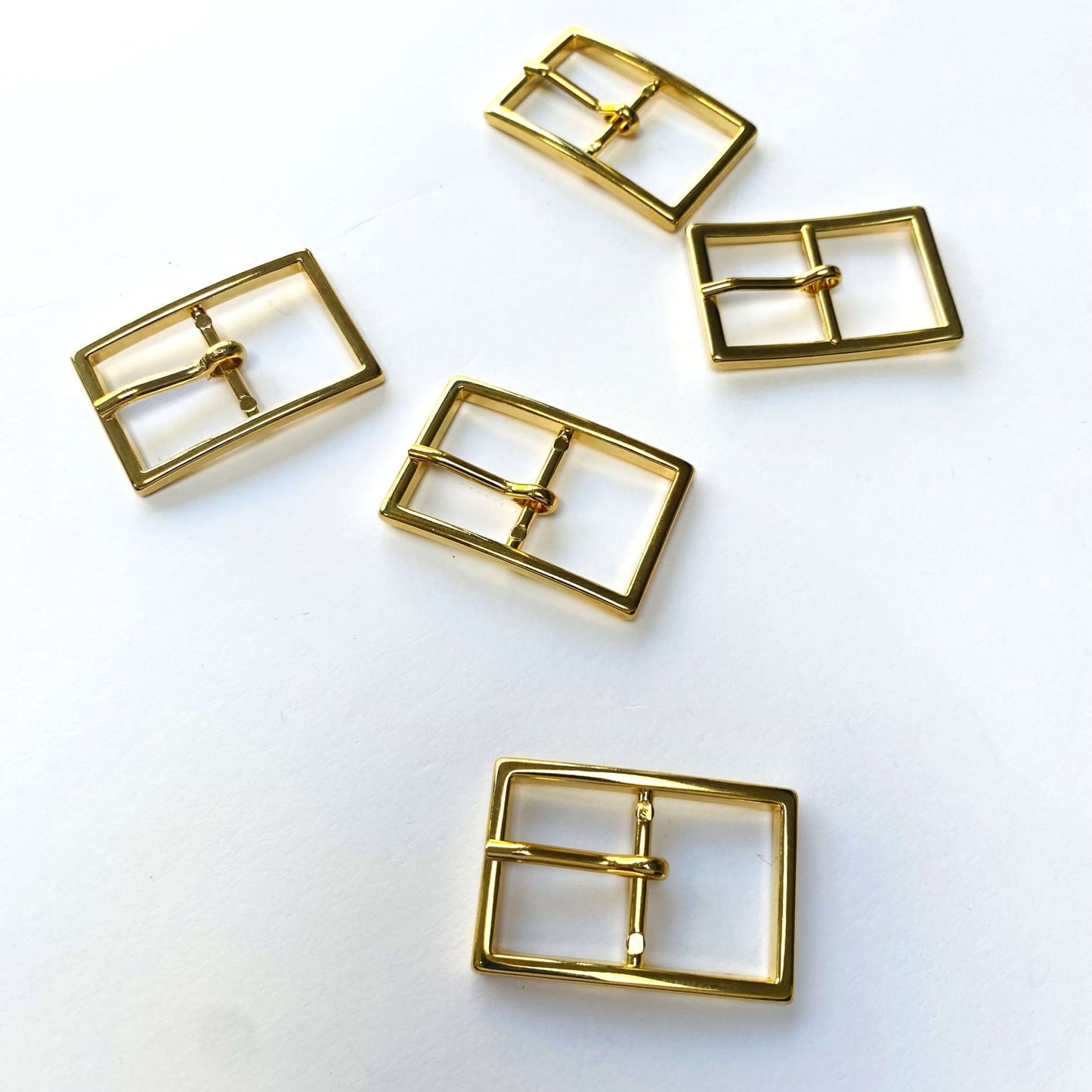 Gold Rectangle Prong Buckle - 40mm - Five gold metal buckles on a white background