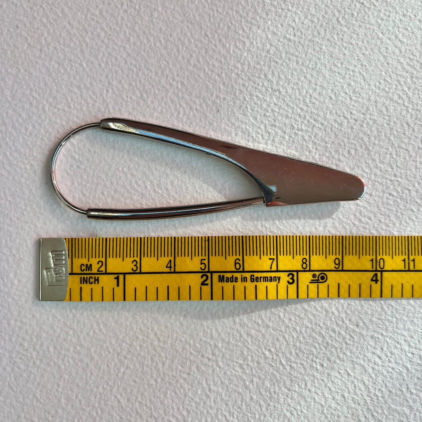 A fun and unusual scarf or shawl pin. Ideal for fastening open weave scarves and blankets, skirts or wearing as a statement brooch.