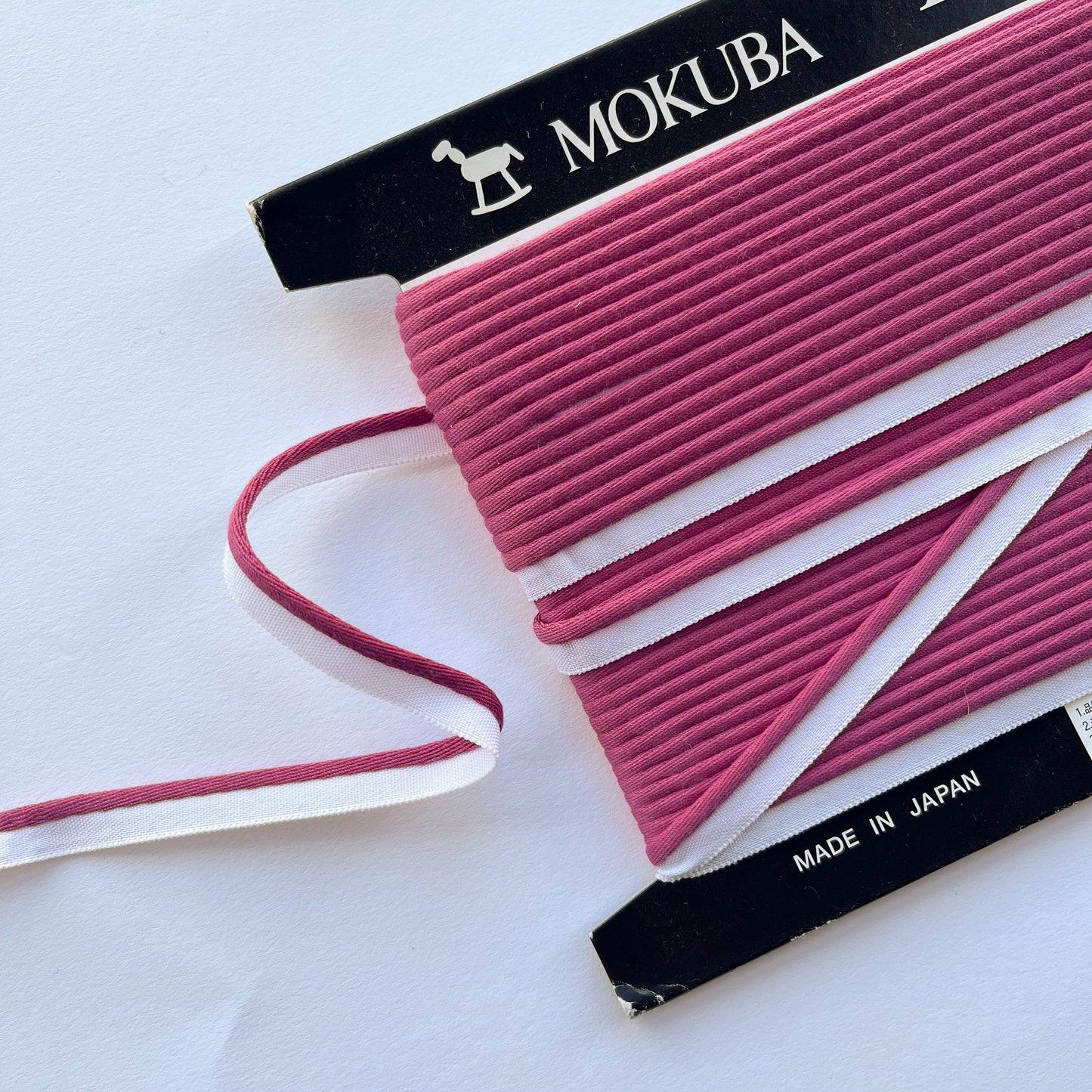 Mokuba raspberry pink piping cord
on a white background