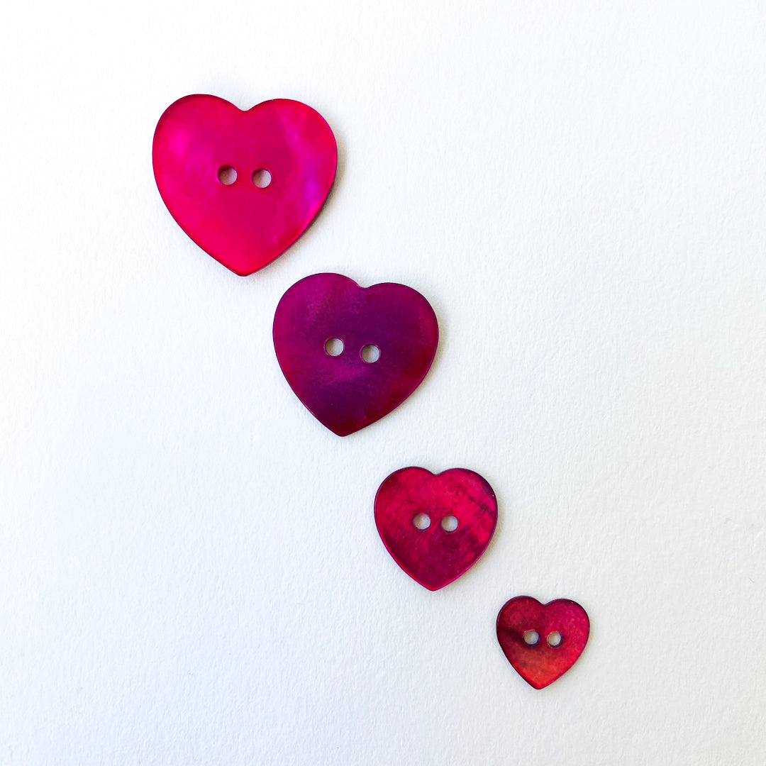 Magenta pearl heart buttons