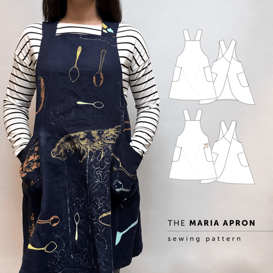 Maria Apron sewing pattern made in blue linen, cross-back apron with large patch pockets