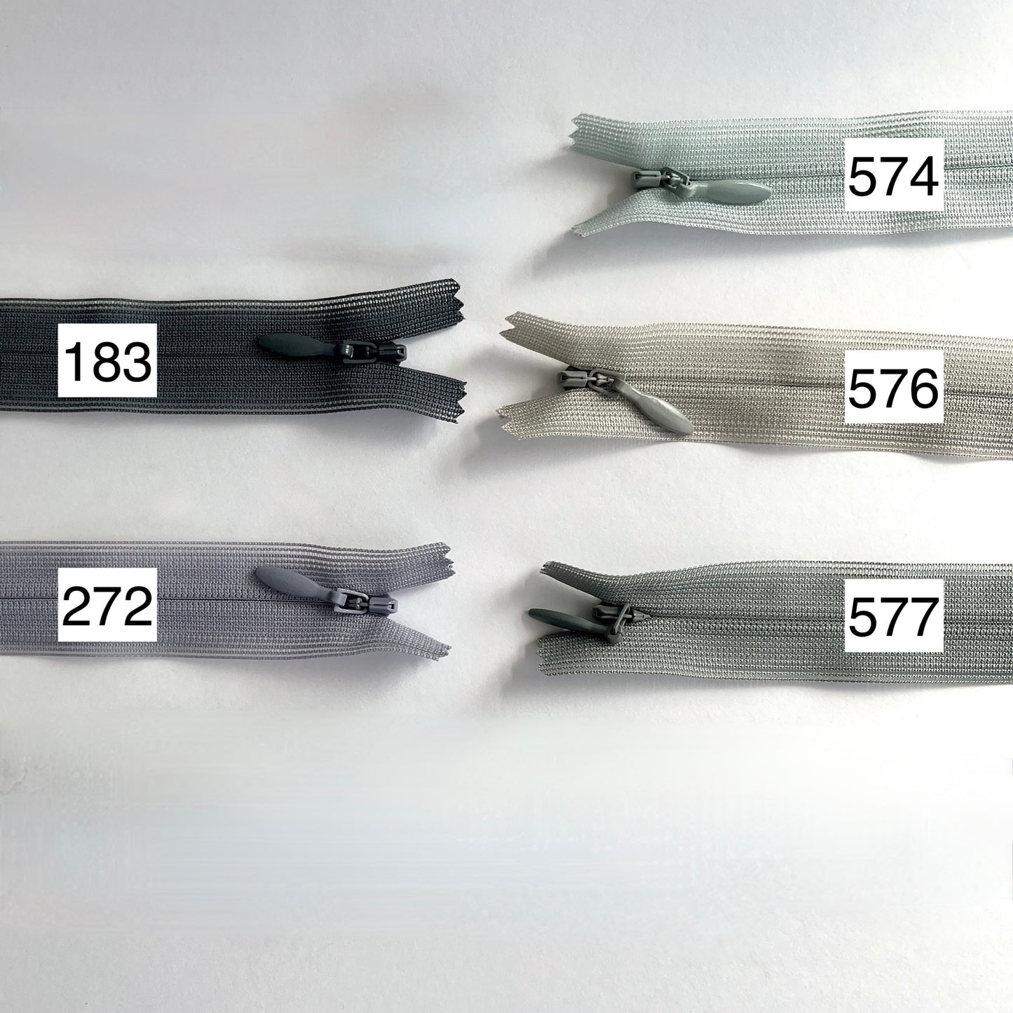 YKK Lightweight Invisible zip in grey shades - 66cm (26") length, Lightweight invisible, concealed zip with closed-end for dressmaking.