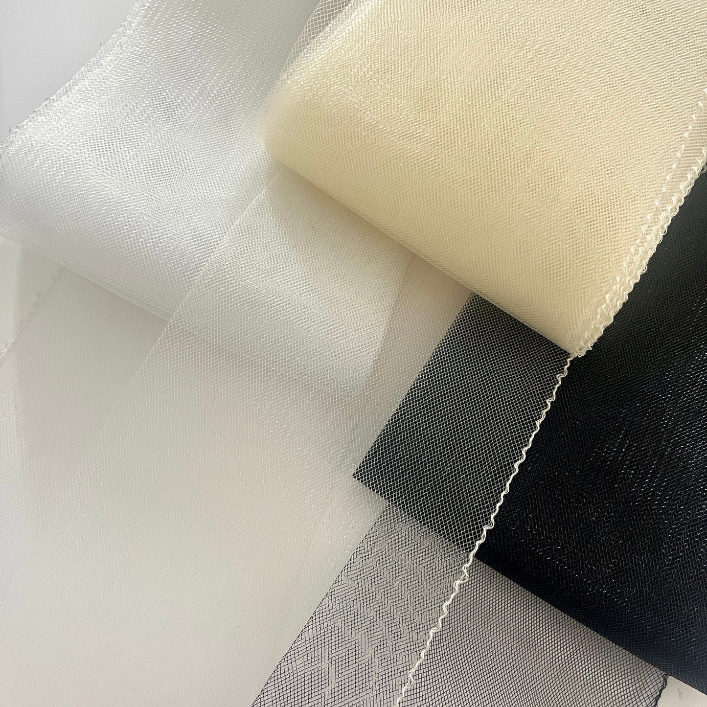 Horsehair braid, also know as crin or crinoline, threaded on one edge for gathering and shaping. Used to stiffen hems, giving flexible shape, support and structure where needed especially for bridal wear, evening wear, prom dresses, petticoats, theatre costumes, dance wear and often used for hat making.
