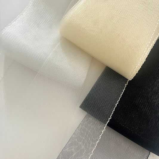 Horsehair braid, also know as crin or crinoline, threaded on one edge for gathering and shaping.  Used to stiffen hems, giving flexible shape, support and structure where needed especially for bridal wear, evening wear, prom dresses, petticoats, theatre costumes, dance wear and often used for hat making.
