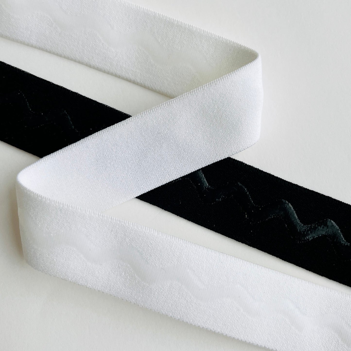 25mm, 1” plush, soft gripper elastic for waists, bra straps and lingerie Non-slip silicone beaded gripper elastic. For use in any garment that requires elastic to stay in place when worn. The silicone acts as a gripper, that's not rigid, to help prevent slipping. Perfect for strapless garments, activewear, bra and lingerie making.