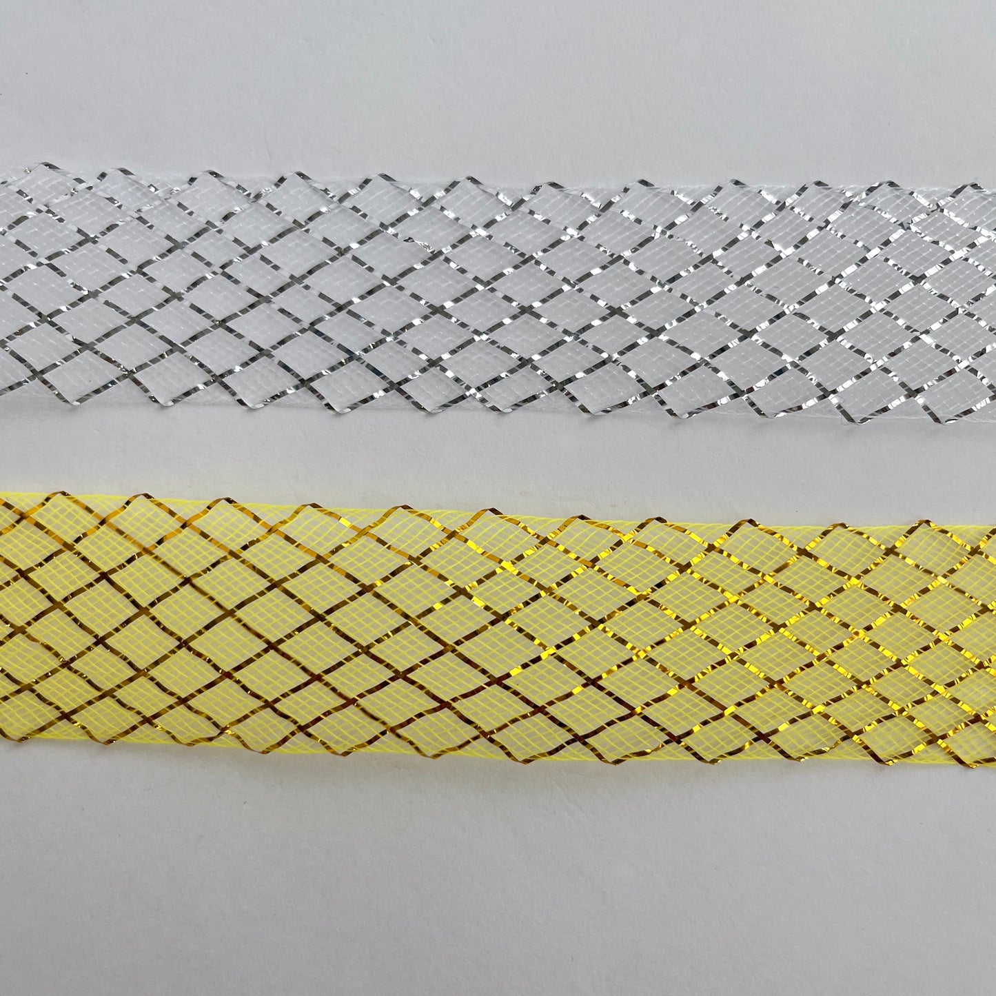 35mm gold, silver lurex Horsehair braid, also know as crin or crinoline, with lurex threads woven into a lattice pattern. Used to stiffen hems, giving flexible shape, support and structure where needed especially for bridal wear, evening wear, prom dresses, petticoats, theatre costumes, dance wear and often used for hat making.