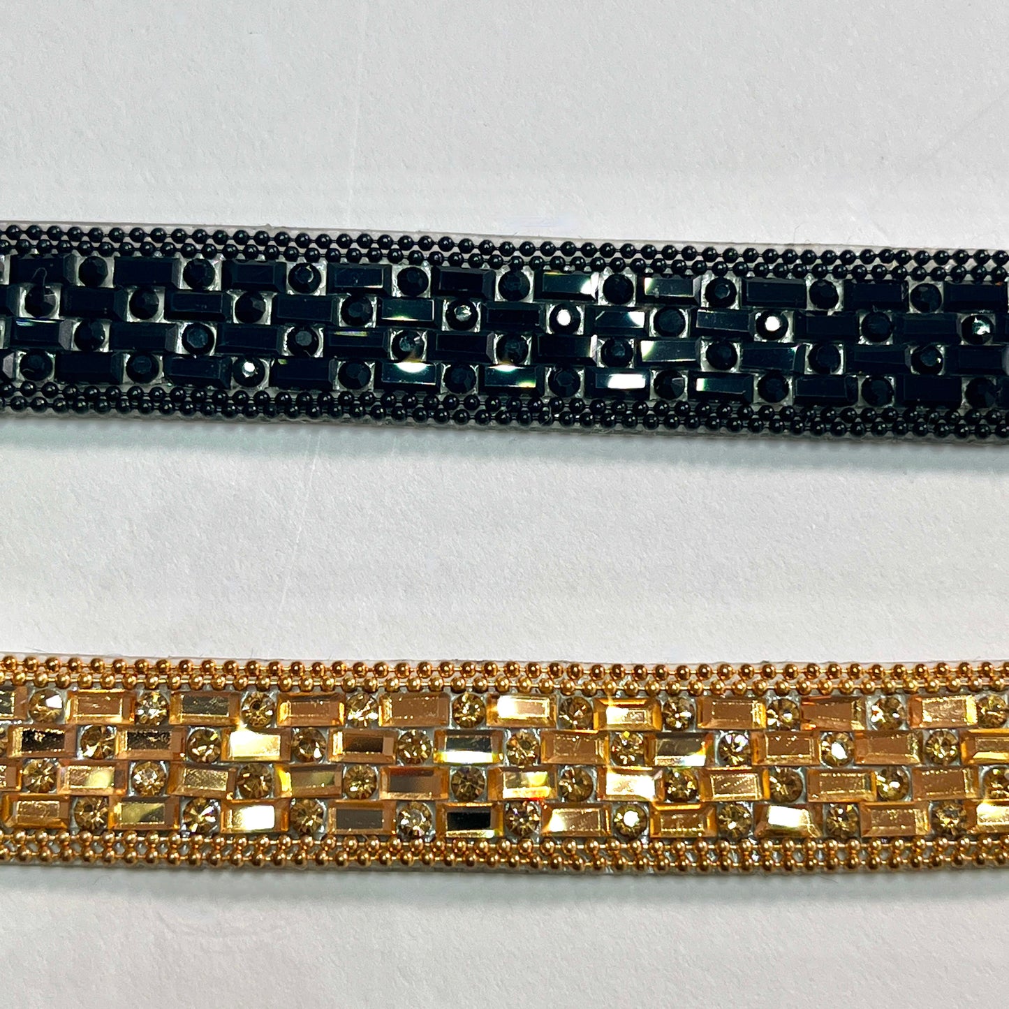A stunning Art Deco inspired trim created with crystals and baguette shaped polished stones for sparkle, with a tiny twin bead edging. This is an iron-on embellishment with a transparent gel backing film and is very easy to cut to length.