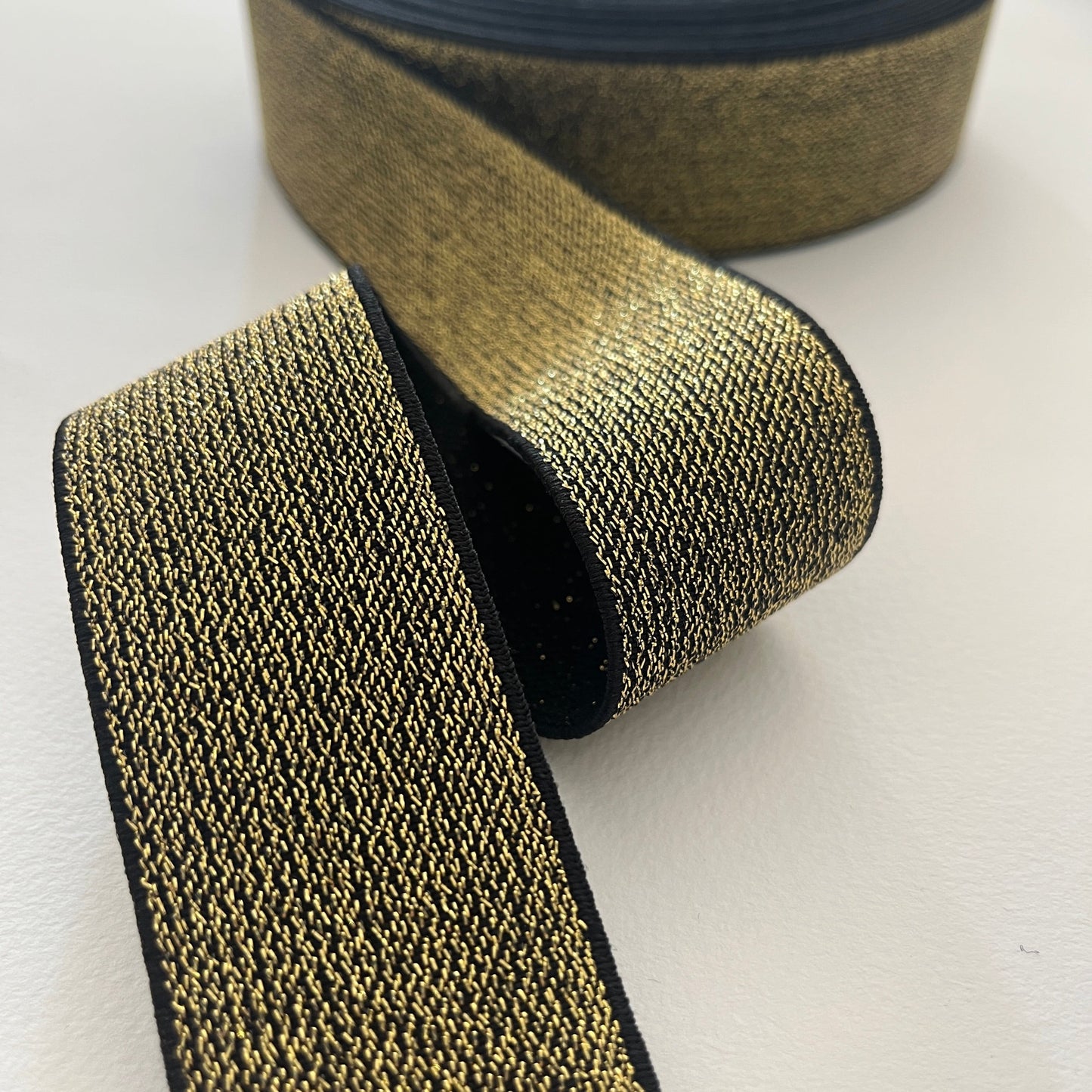 How fabulous are these lurex elastics? Perfect for adding a bit of sparkle and stretch to a waistband, cuff or elasticated belt. Can be worn directly against the skin as it is soft and non-scratchy on the reverse side. gold lurex elastic
