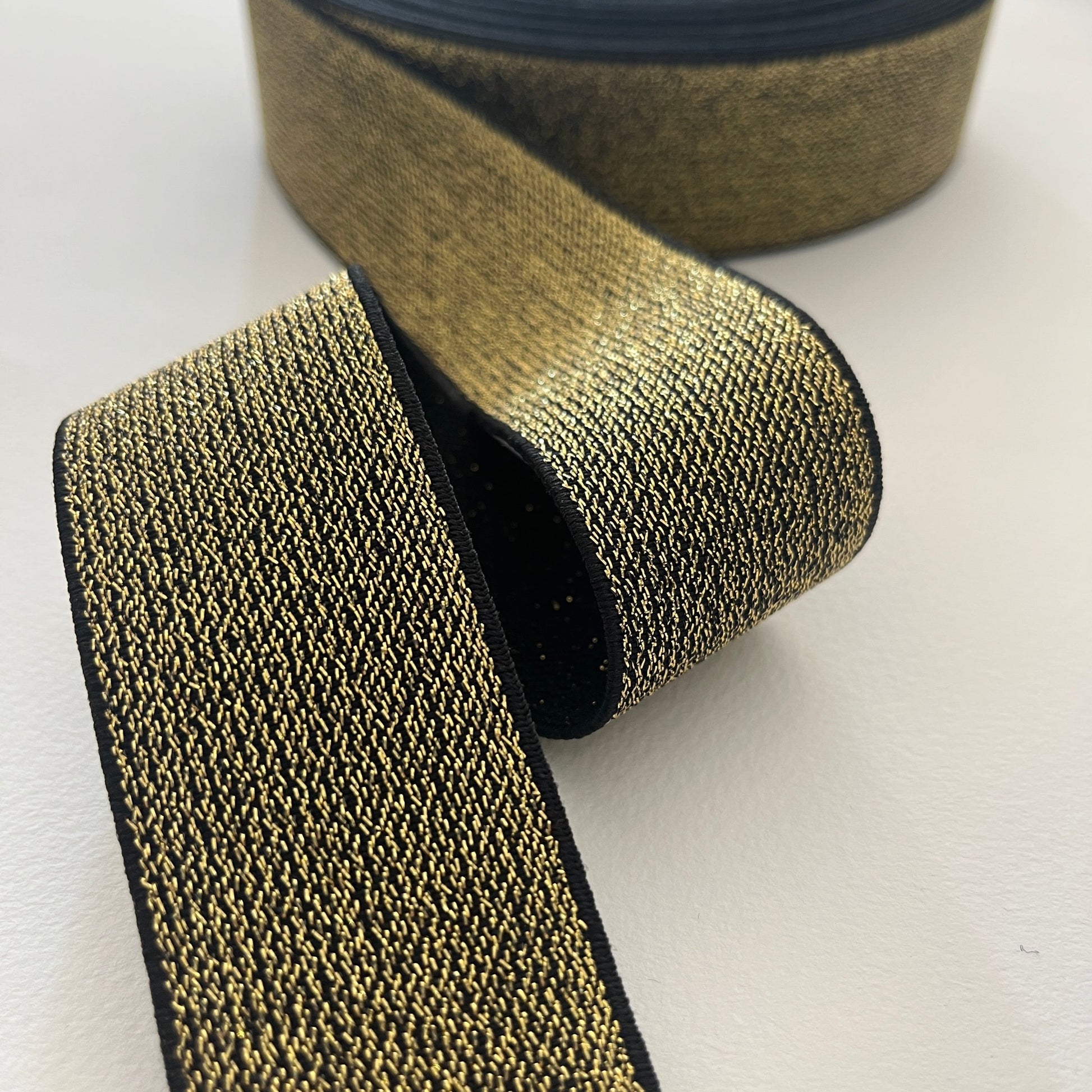 How fabulous are these lurex elastics? Perfect for adding a bit of sparkle and stretch to a waistband, cuff or elasticated belt. Can be worn directly against the skin as it is soft and non-scratchy on the reverse side. gold lurex elastic
