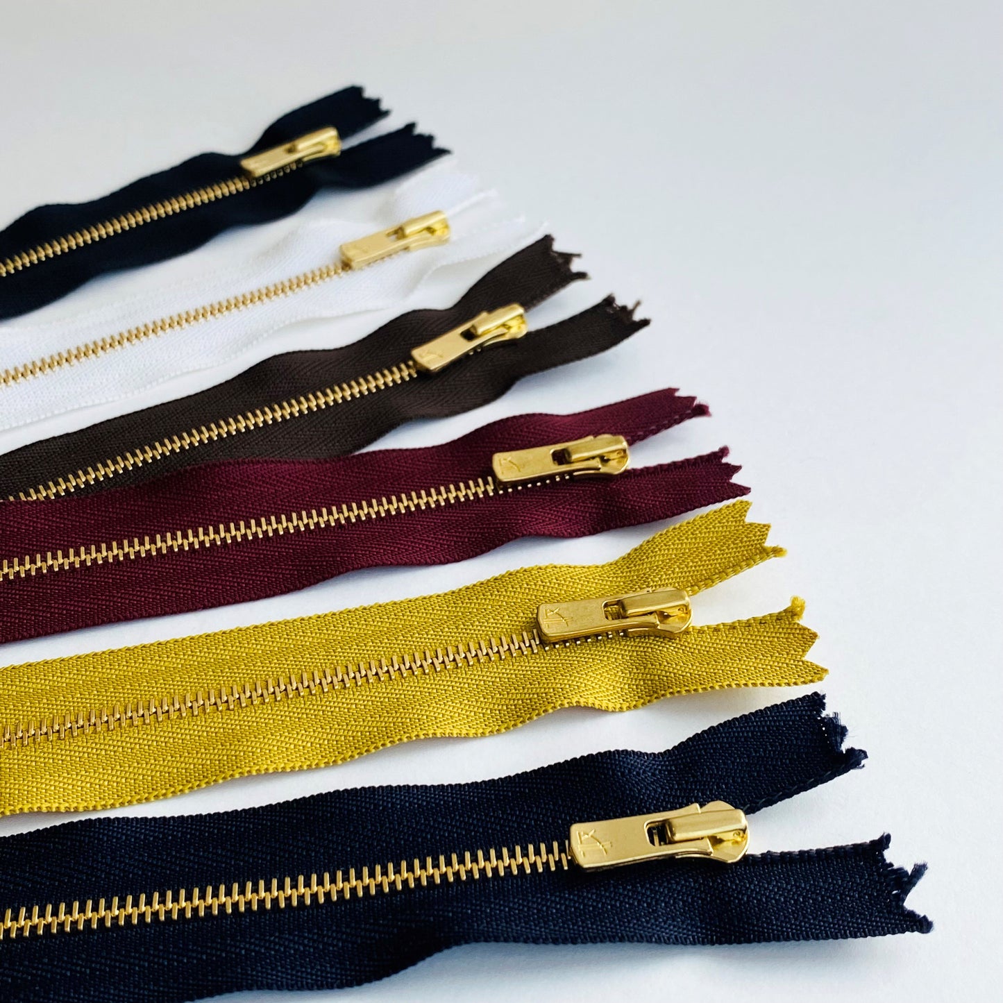 #3 Dress Weight Gold Metal Teeth Closed End Zip by YKK’s EXCELLA®
