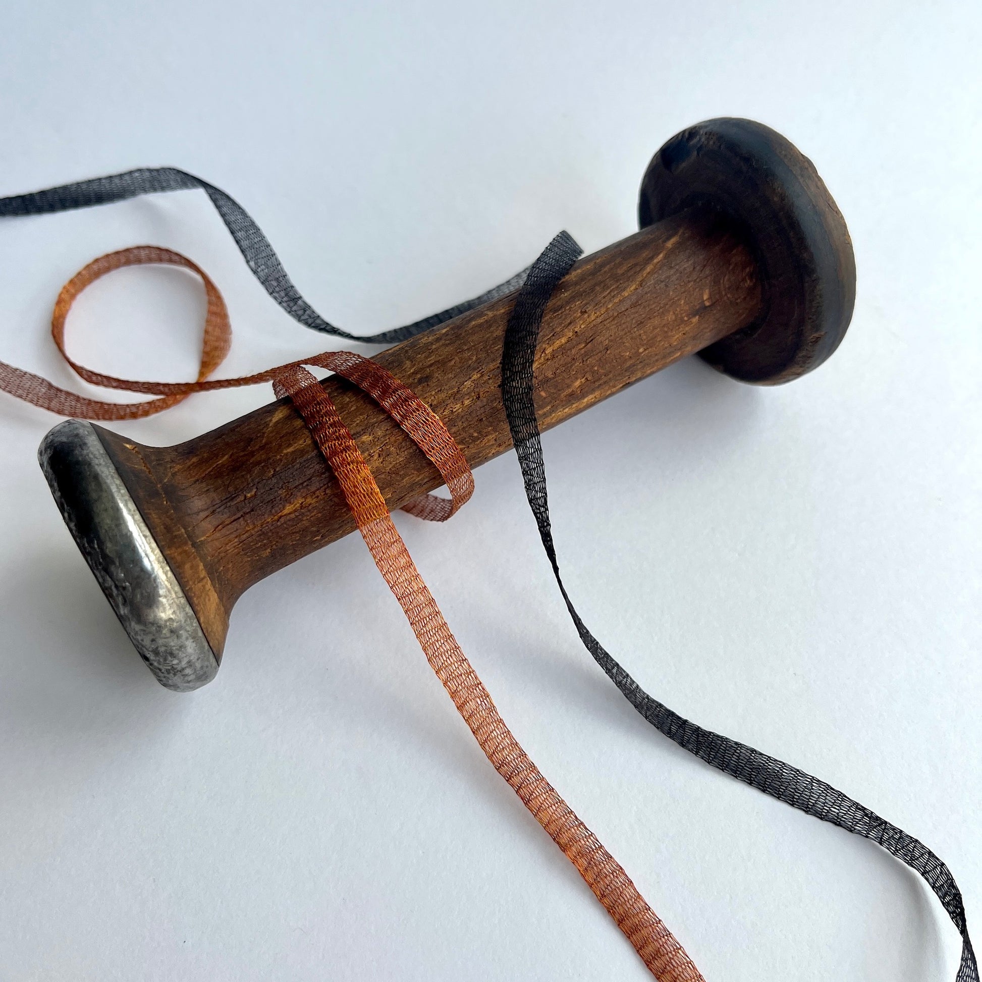 Metallic Woven Tubular Braid  Knitted metallic mesh trim that could be used for straps or used for jewellery creations. Tthe trim can be pulled from either side to create unique shaped contortions.