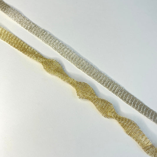 Italian Mesh wire ribbon trimming by Menoni Knitted metallic tubular mesh trim that could be used for straps or used for jewellery creations. The trim can easily be pulled from either side to create unique shaped contortions for floral arranging, jewellery making and beading.