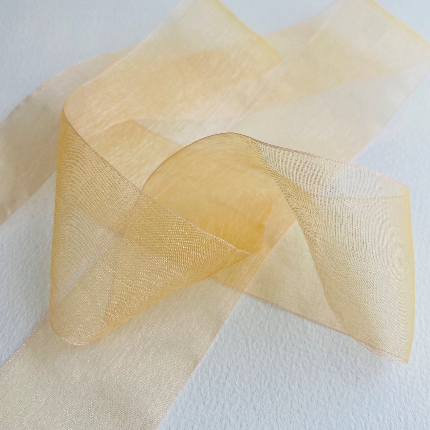 50mm Chiffon ribbon by MOKUBA A luxurious soft sheer chiffon ribbon trim by Mokuba, which comes in 6 beautiful colours. Col: Gold 01, Blue 02, Navy 09, Grey 15, Blush 16, and Red 23.