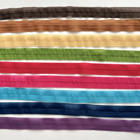 A beautiful sheer chiffon fold-over stretch binding. 16mm wide with a centre fold. Use as a binding for necklines and armholes on stretch fabrics, for straps, lingerie and underwear making, headbands, hair ties, dancewear and active wear projects.