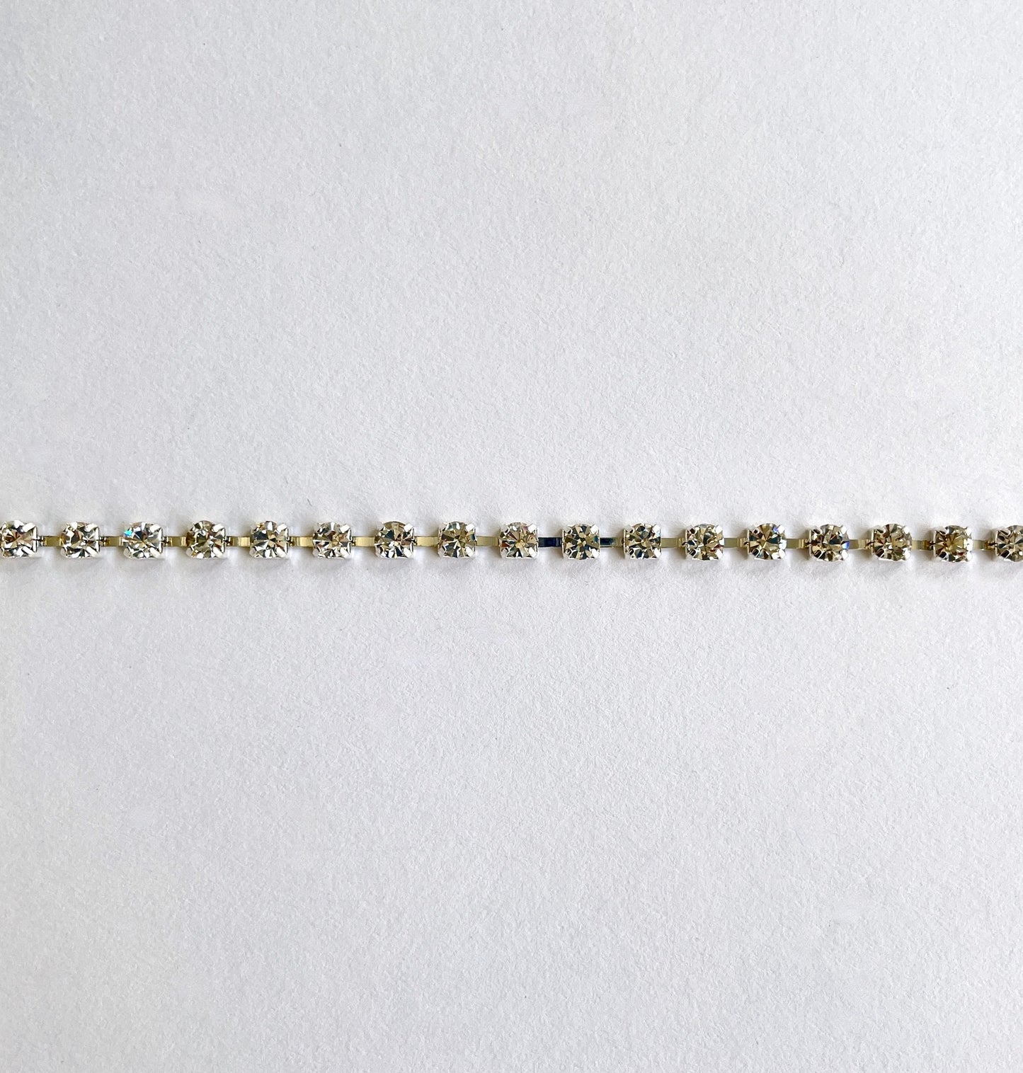 Sparkly rhinestone trim - premium high grade diamanté crystals set in a flexible metal chain casing. Popular for bridal wear, evening wear, crafts, jewellery and headband making.