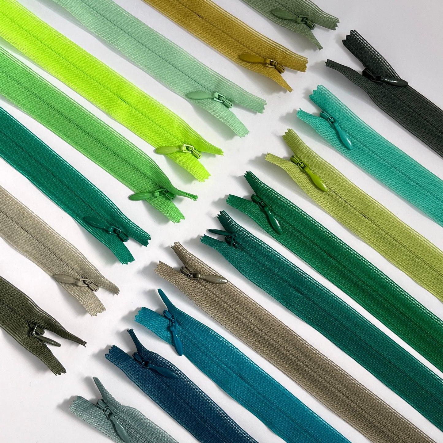 YKK Lightweight Invisible zip in Green and Olive shades - 66cm (26") length, Lightweight invisible, concealed zip with closed-ended for dressmaking.