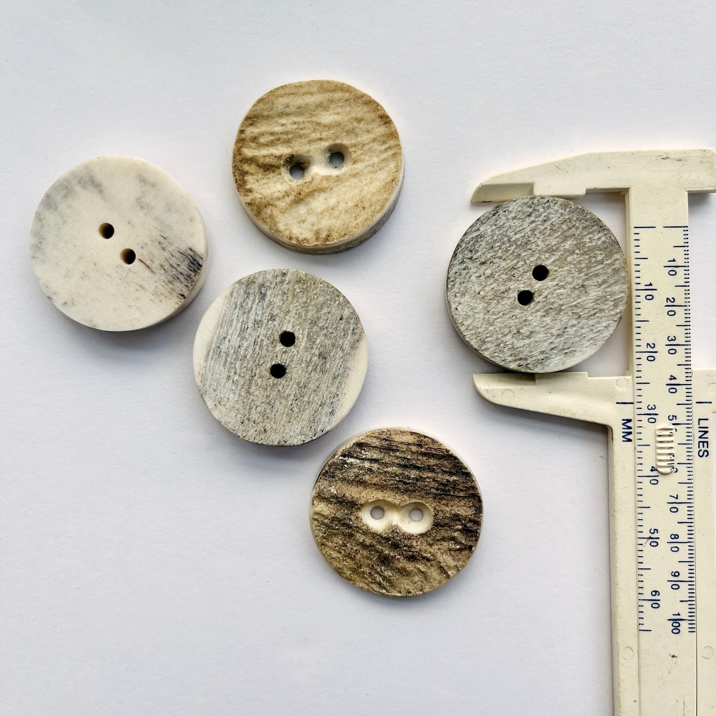 large horn natural antler buttons, Horn buttons made from Scottish red deer antlers which shed naturally every year, and are a by product of the Scottish deer farming industry