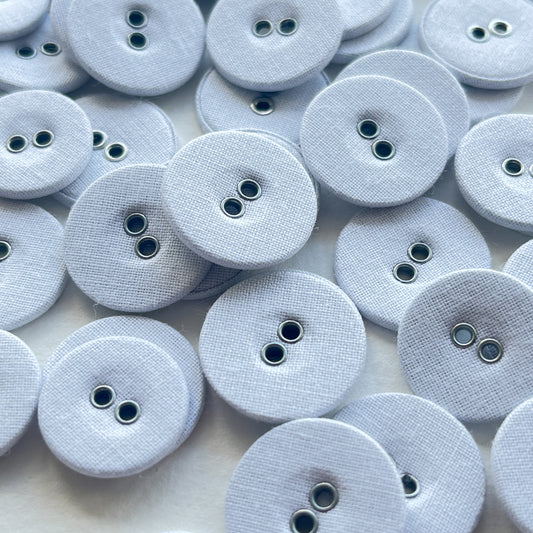 Lovely utilitarian, vintage style linen covered buttons. Flat with 2 holes and fabric on both sides of the button. Price is for 10 buttons Colour: white Sizes: 26 Ligne (16mm), 28 Ligne (18mm), 30 Ligne (19mm)