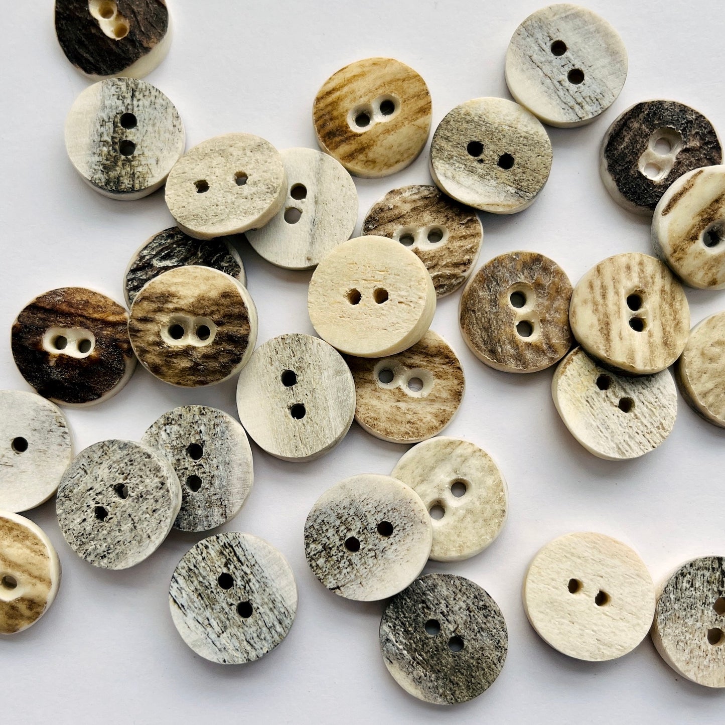 Horn buttons made from Scottish red deer antlers which shed naturally every year, and are a by product of the Scottish deer farming industry, a sustainable button