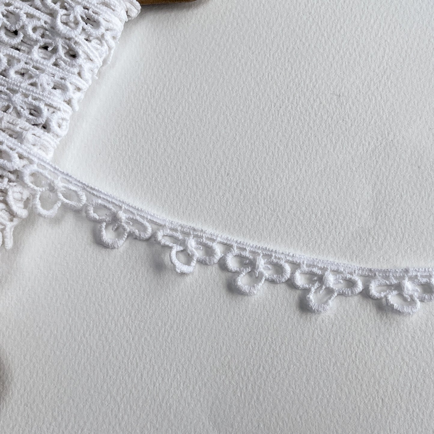 Vintage Trefoil Cotton guipure lace trim with a matt finish, we believe to be from the 1980s