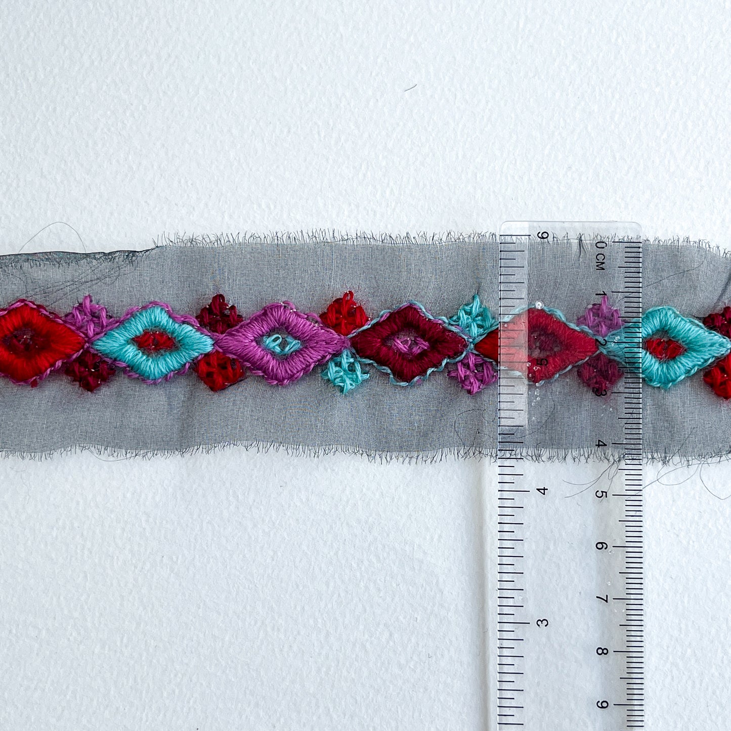 Geometric folklore embroidered trim. Beautiful embroidered trim with geometric 'folklore' design.
