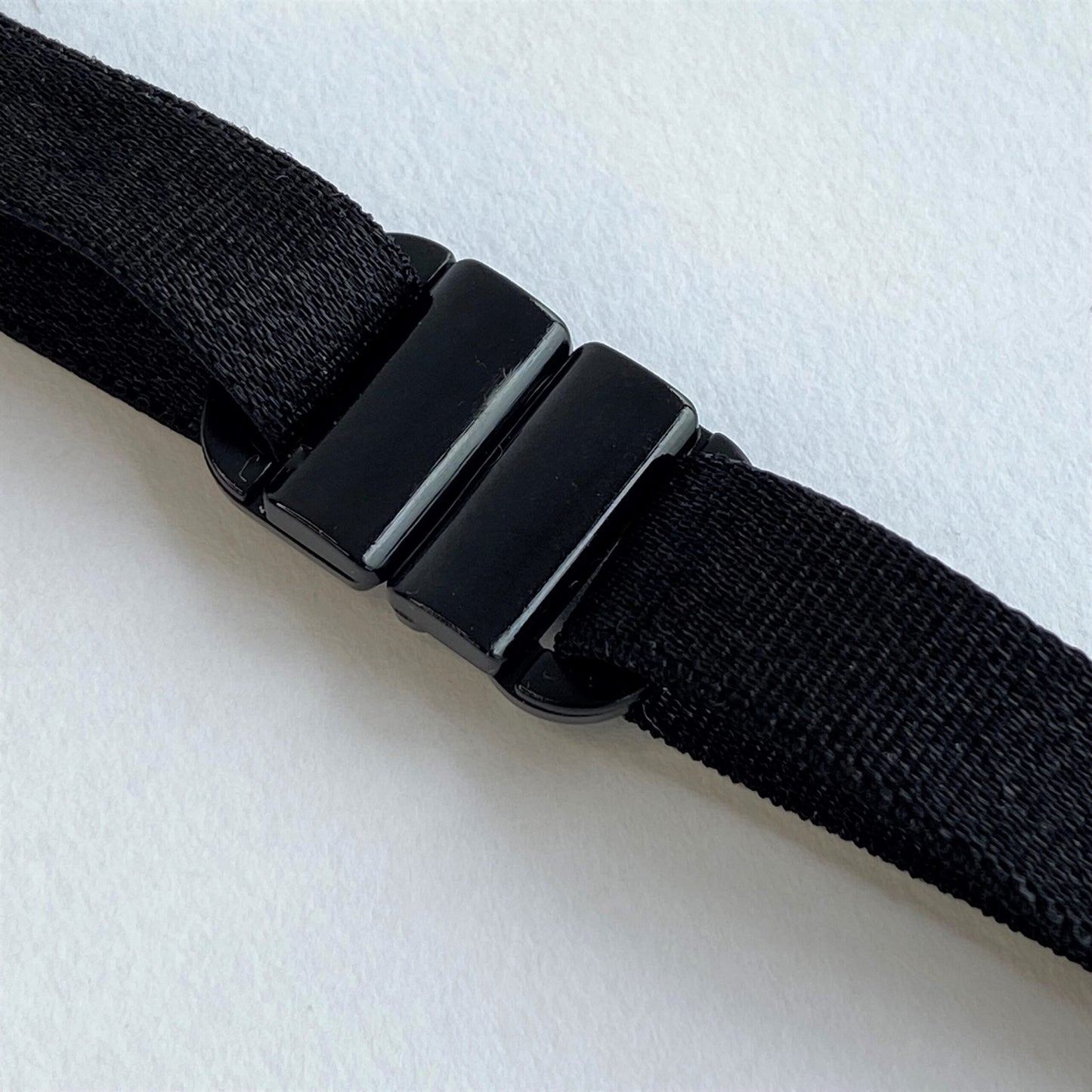 Black BikiniClasps on a light gray background