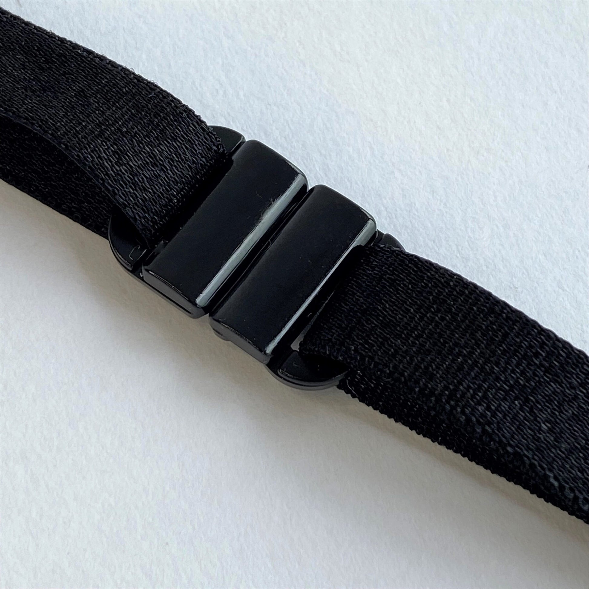 Black BikiniClasps on a light gray background