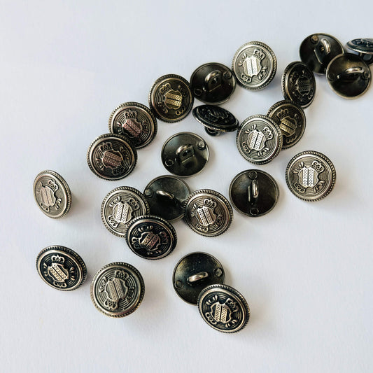 15mm Crested Military Shank Buttons in Antique silver on a white background