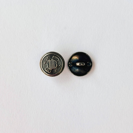 close up of 15mm Crested Military Shank Buttons in Antique silver