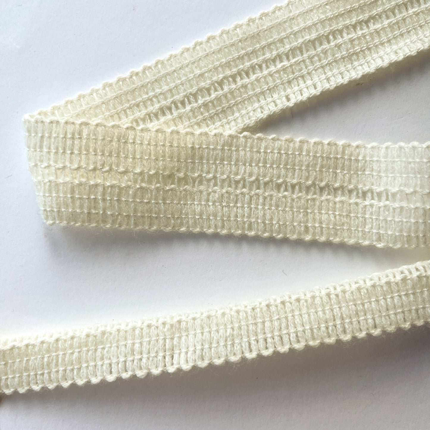 Close up of Cream 17mm Knitted fold over Binding Tape 