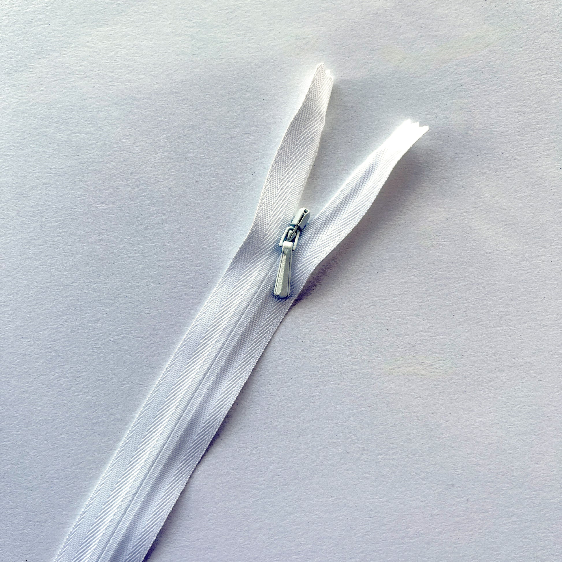 white zipper on a white background