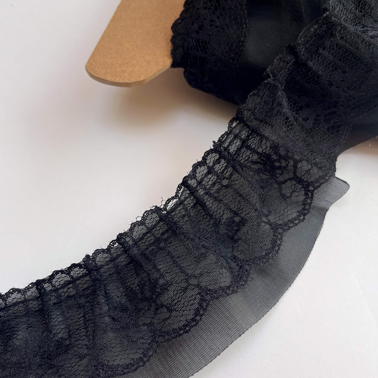Black lace trim on a white background