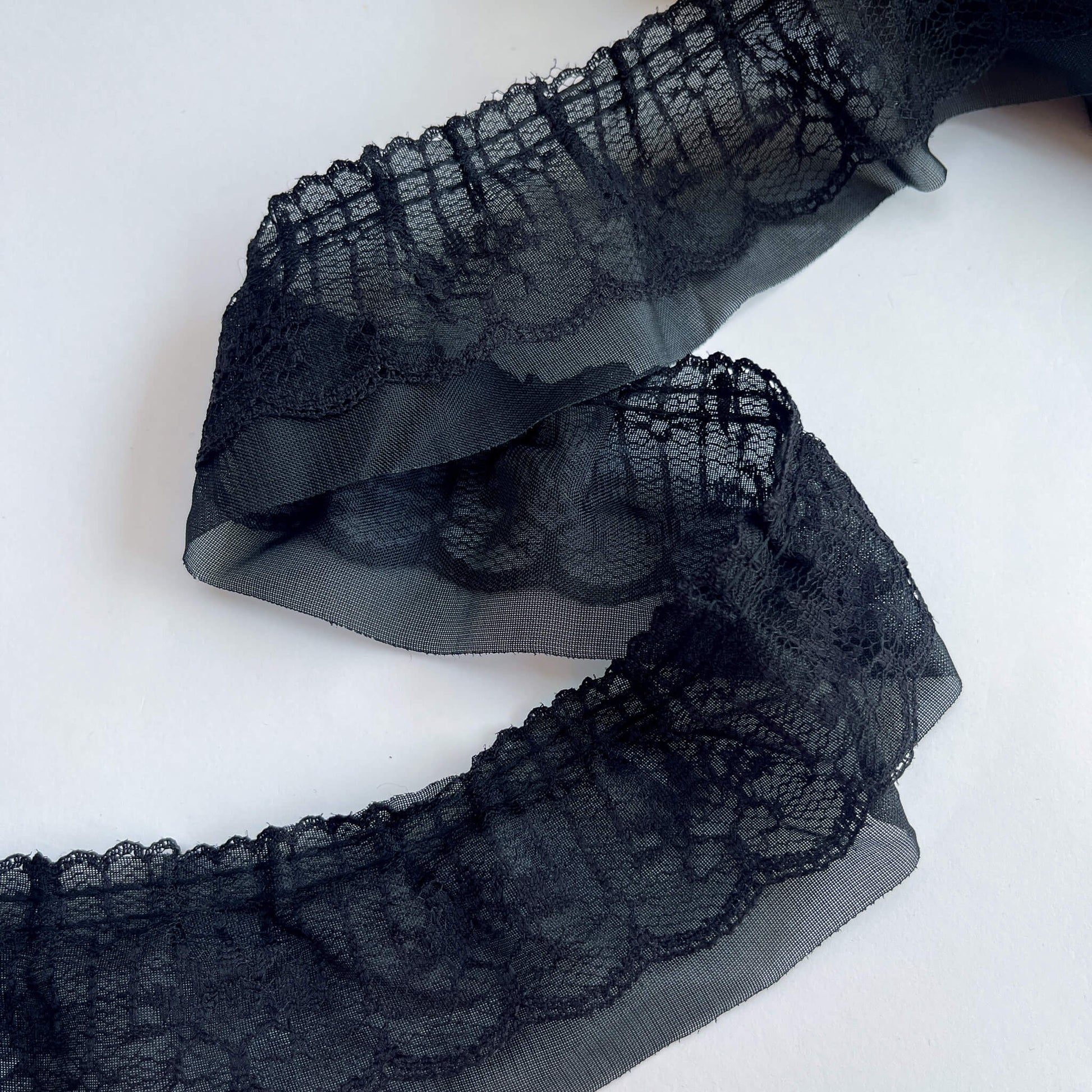 2 layer Black lace trim on a white background
