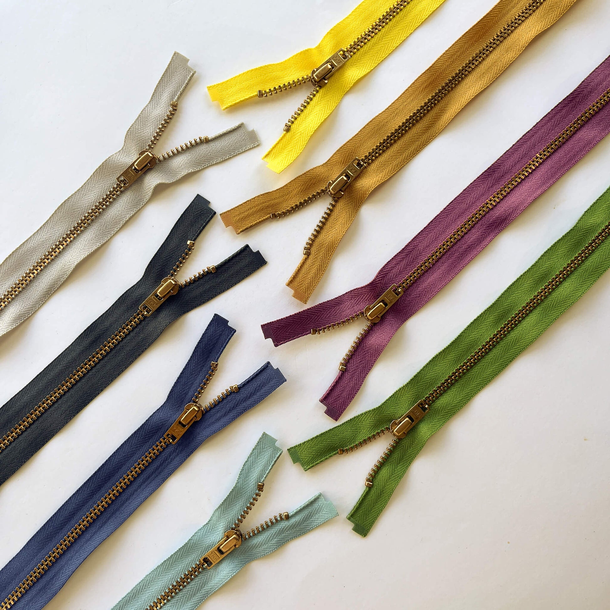 YKK #4.5 Open End Brass Zip,70cm length  YKK  jeans zip with brass metal teeth and auto-lock puller in various shades -  Kleins Haberdashery