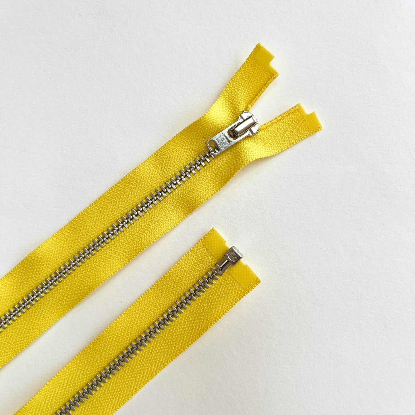 YKK #4.5 Open End SILVER Zip 70cm length  YKK  jeans zip with SILVER metal teeth and auto-lock puller in yellow -  Kleins Haberdashery