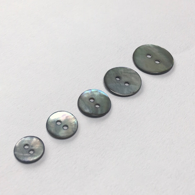 Natural Akoya shell buttons in smoke colourway, made from sustainable saltwater shells  These beautiful buttons are also known as Agoya or Mother of Pearl buttons and have a beautiful iridescent sheen