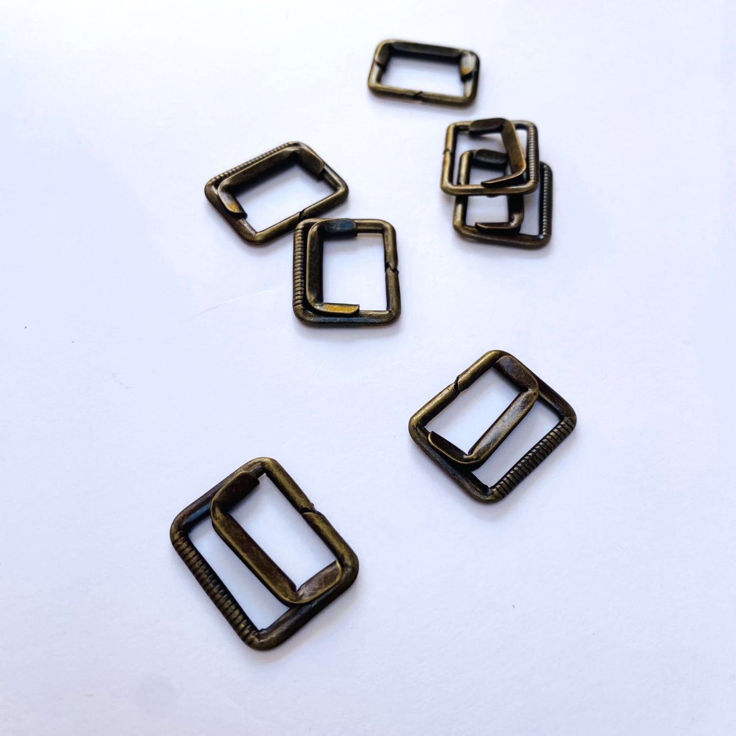 Antique Brass Waistcoat Buckle - 19mm - Set of bronze rectangular metal buckles on a white background