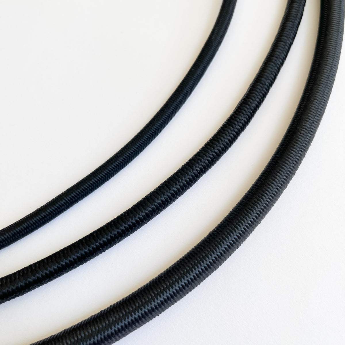 Black elastic shock cord in 6mm, 8mm and 10mm widths