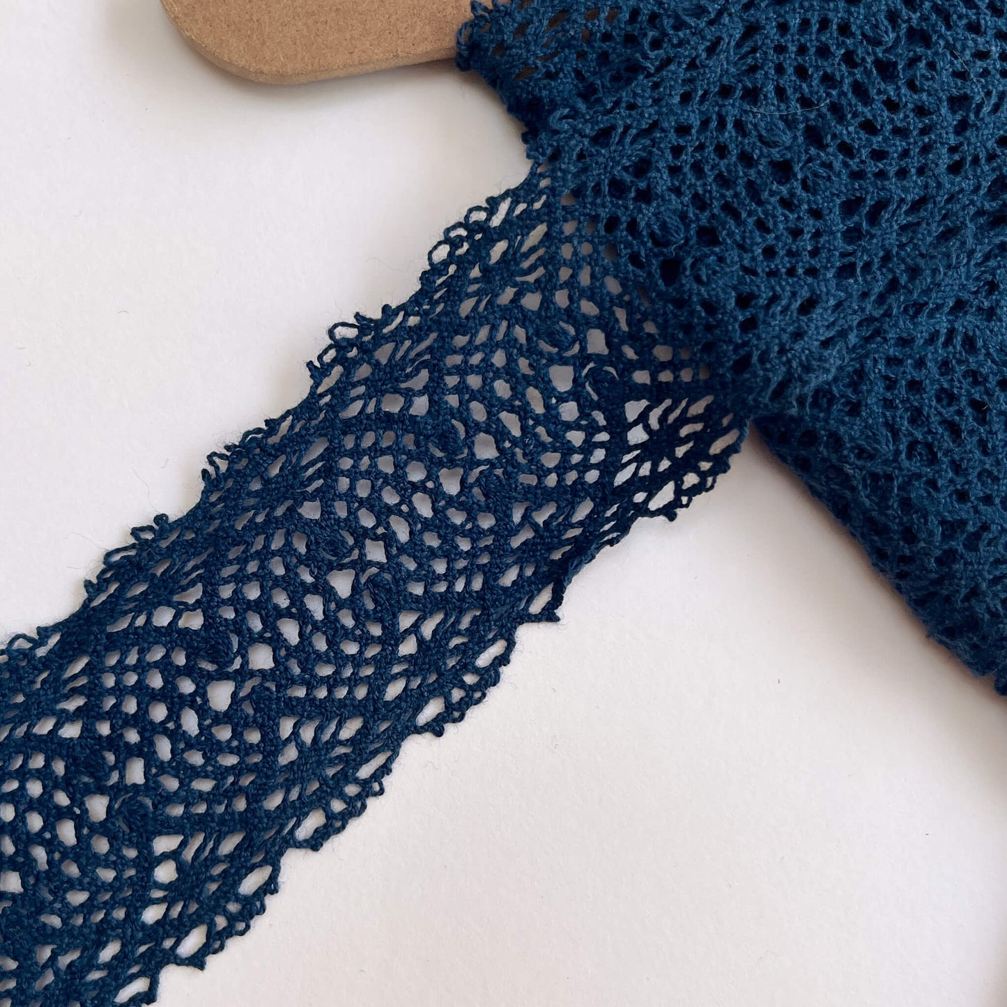 Wide Blue Duchesse Cotton Lace trimming on a white background