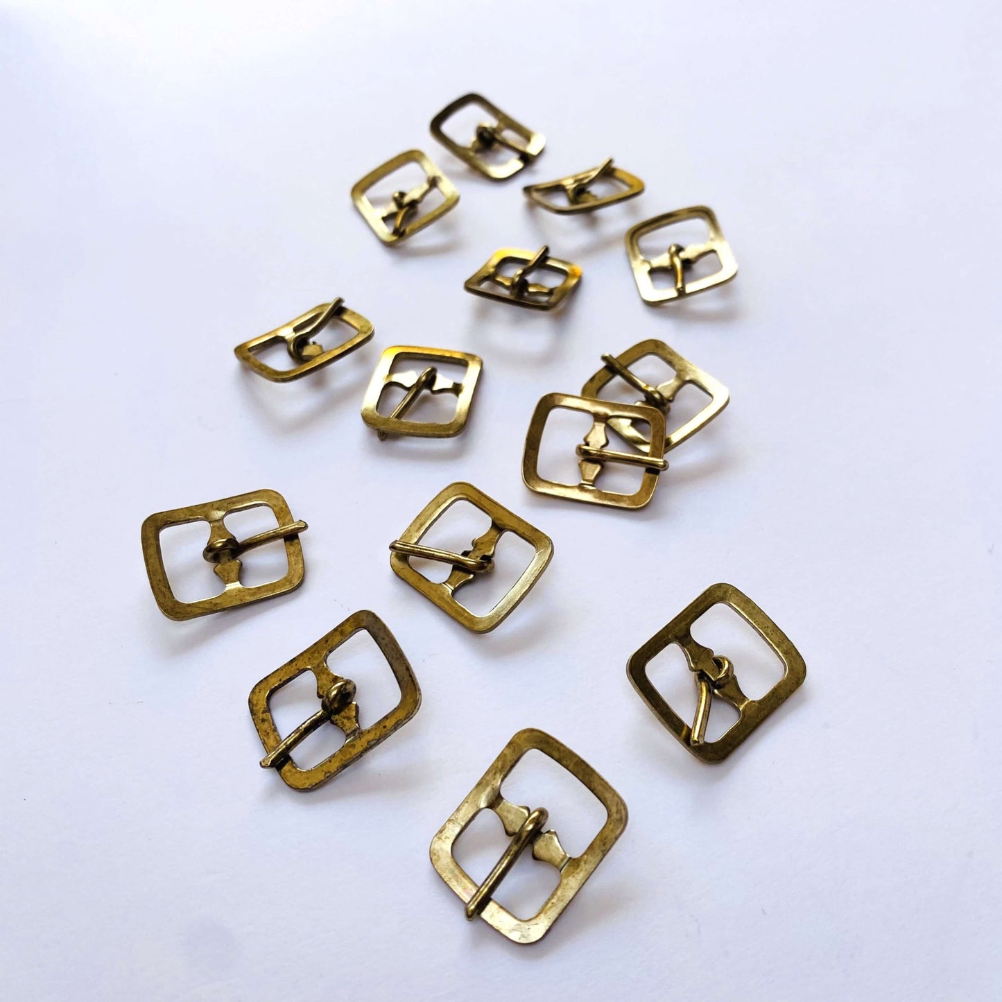 Brass Prong Rectangle Buckle - 12mm  -Gold metal buckles on a white background