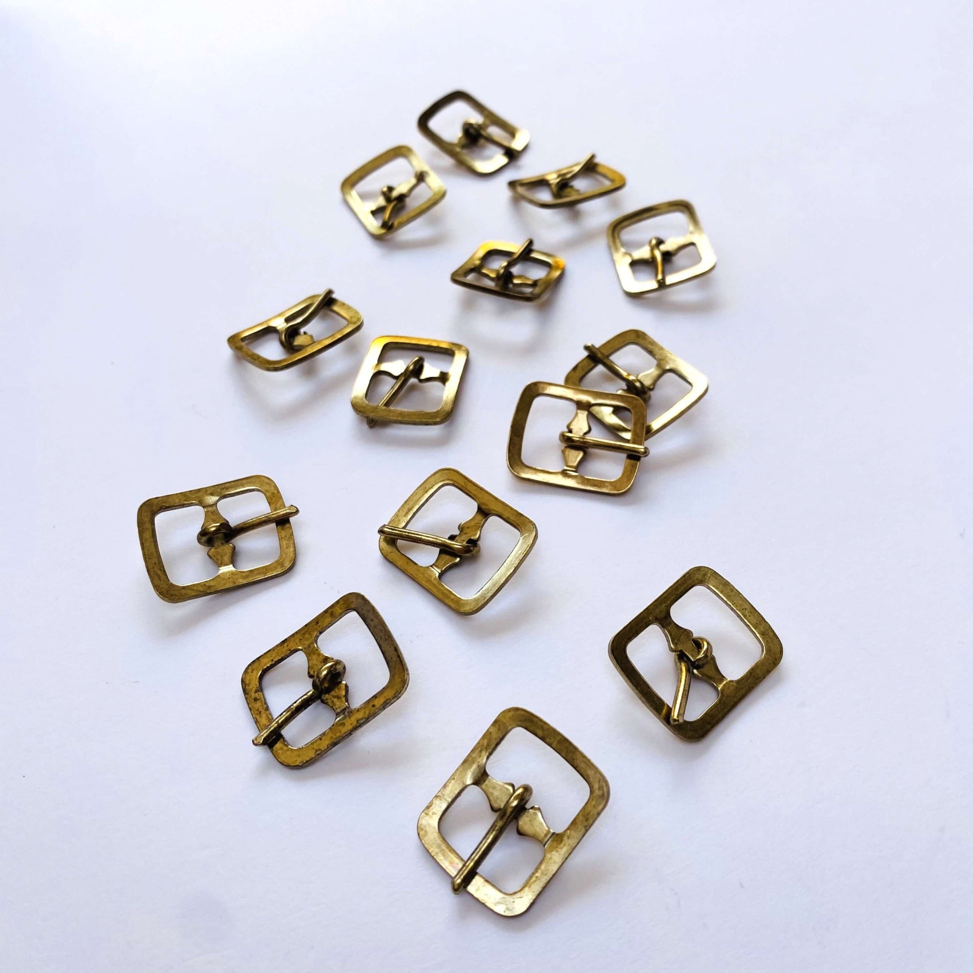 Brass Prong Rectangle Buckle - 12mm  -Gold metal buckles on a white background