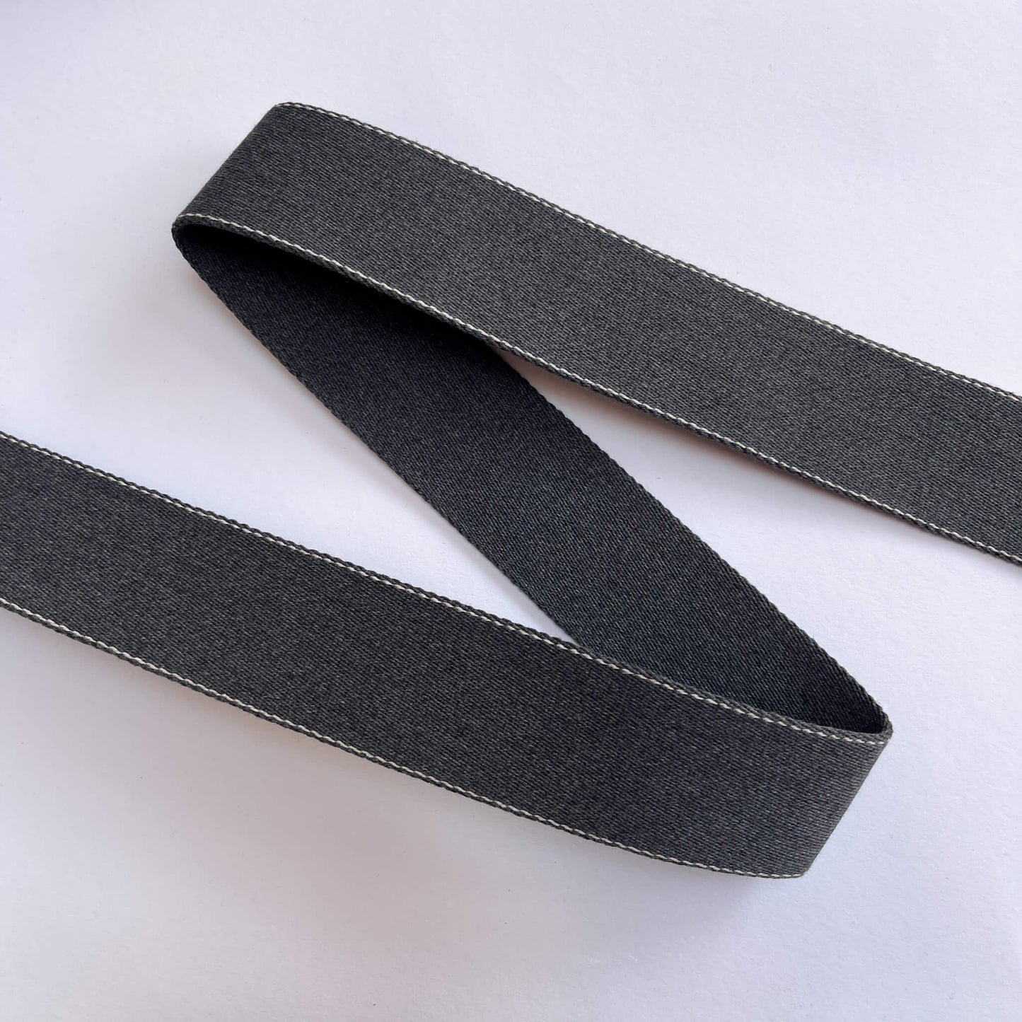 40mm recycled cotton webbing showing plain and stitched sides