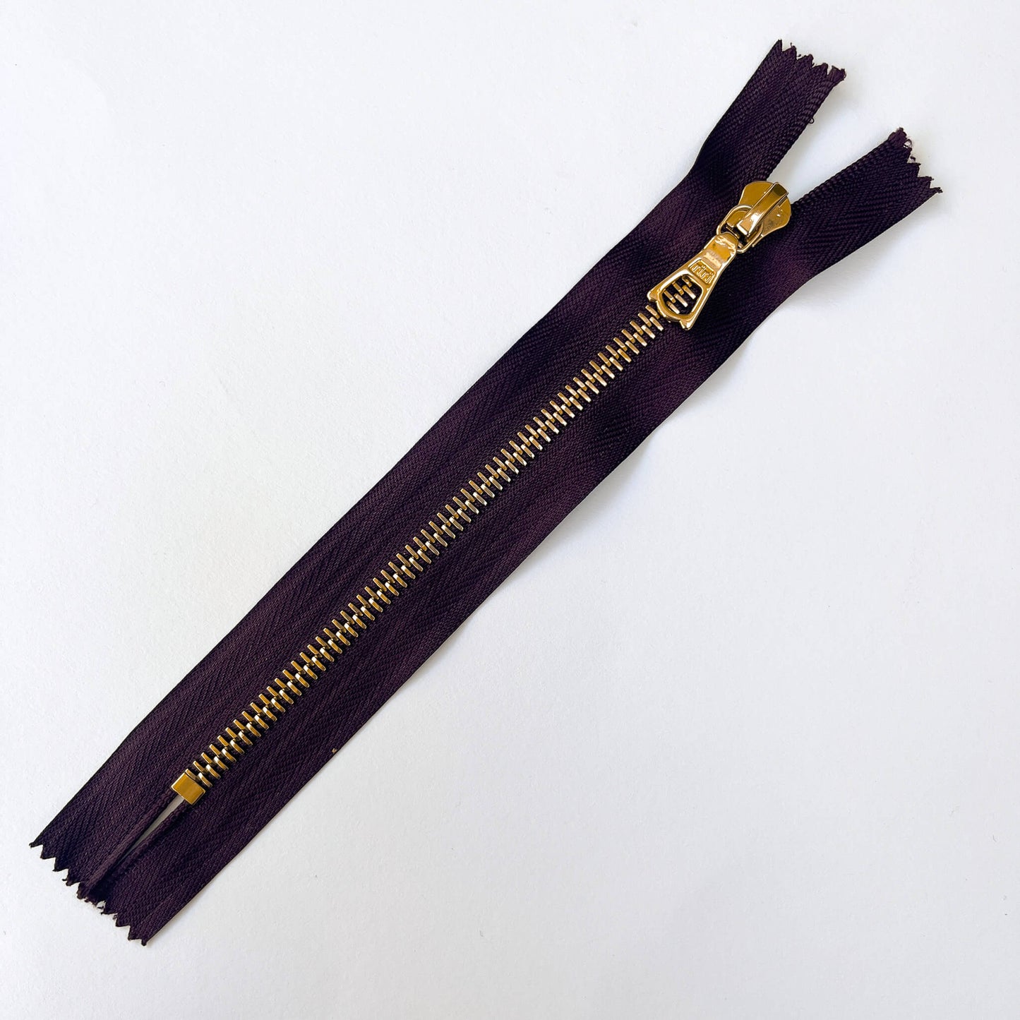 Dark Plum, dark purple  RiRi #6 Metal Zip - 17cm  by RiRi with gold metal teeth and decorative puller - Kleins Haberdashery